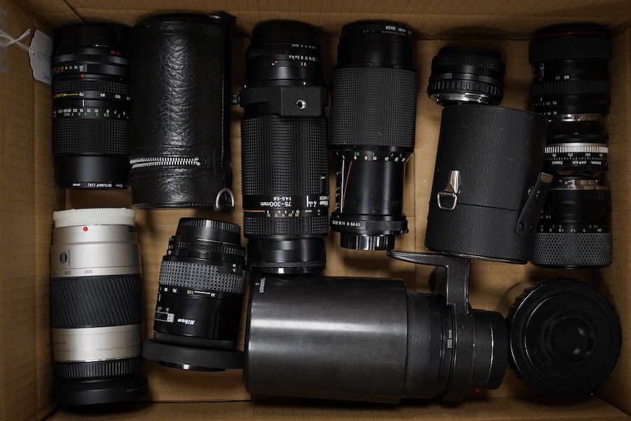 Ten SLR camera bodies by Nikon, Olympus, Canon, Pentax, etc., together with twelve lenses by Nikon, Minolta, Tamron, Vivitar etc. and other accessories including a selection of camera flash lights, etc. Condition - poor